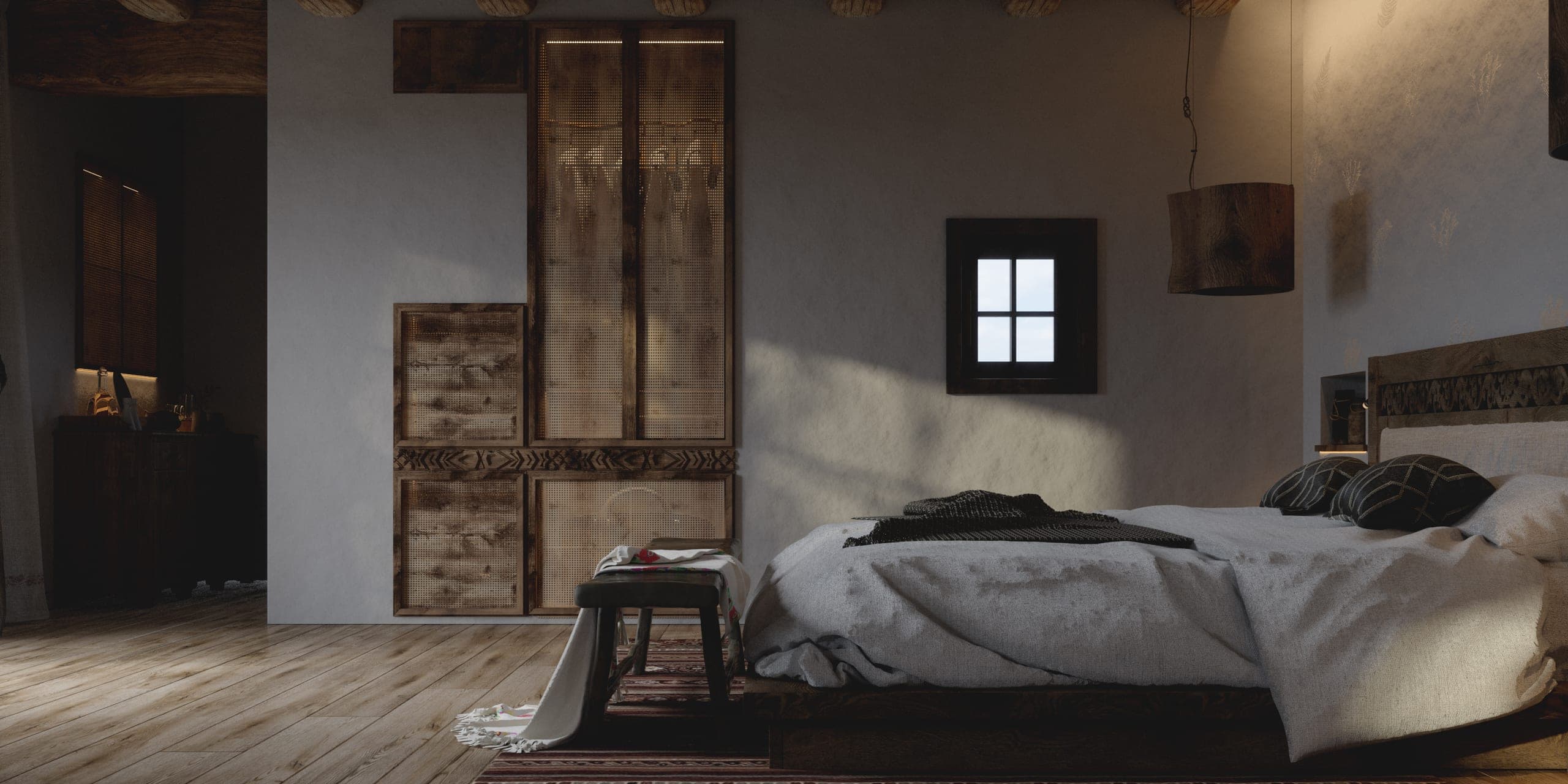 Matca guest room: bed beneath a small window, with a carved timber wardrobe