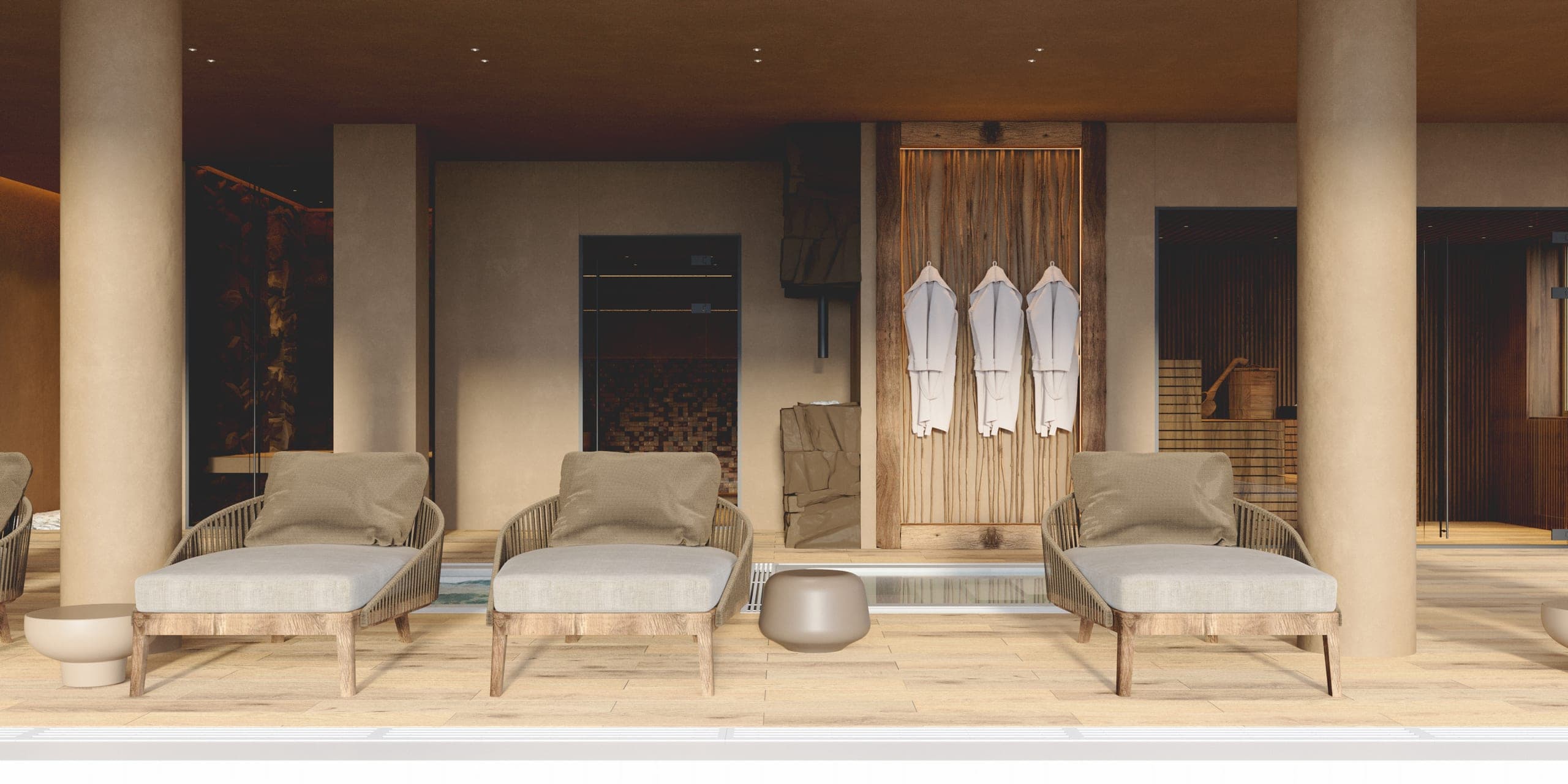 Natura Spa: loungers beside the pool with robes hanging behind