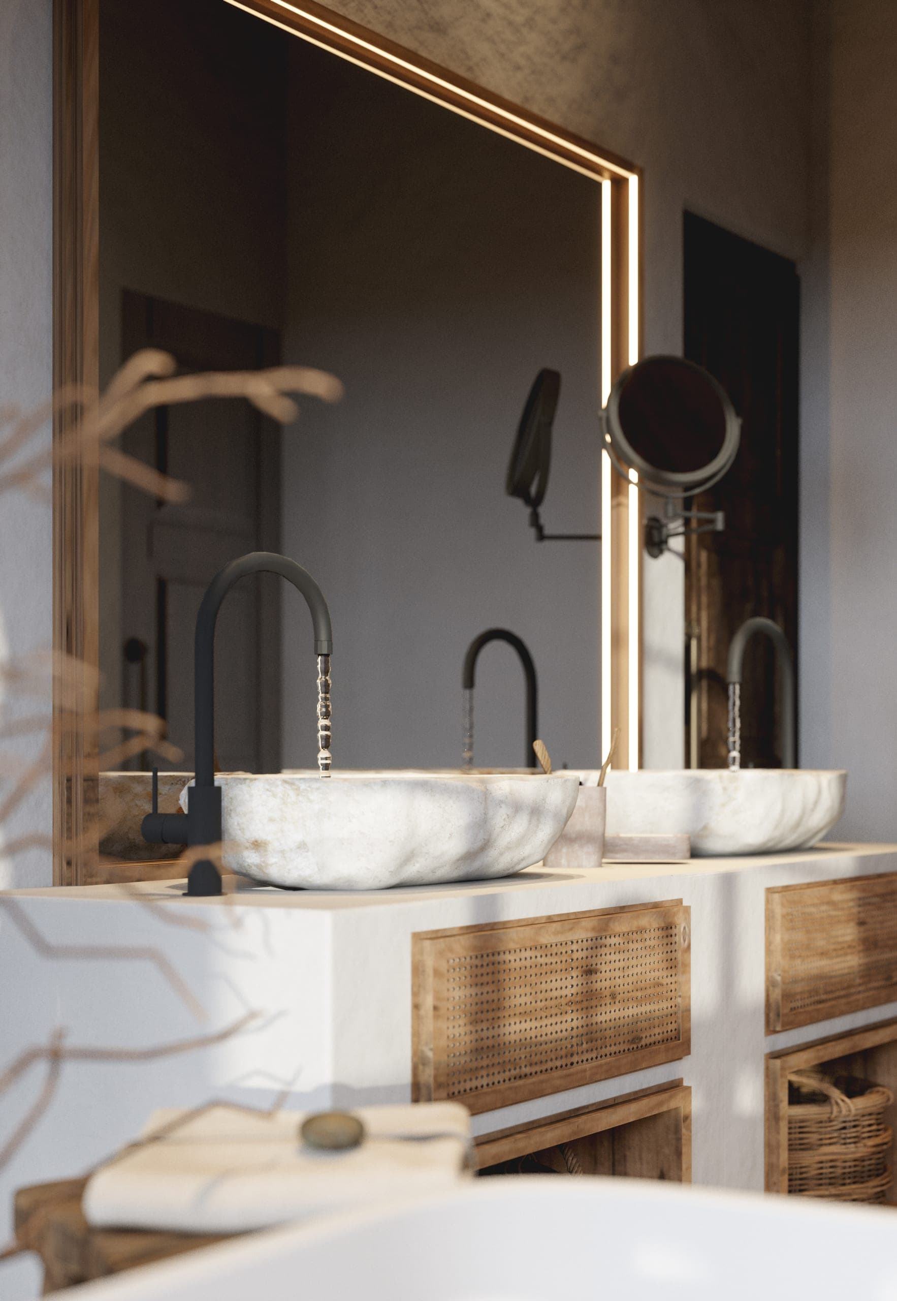 Matca private villa: stone basins beneath a backlit mirror