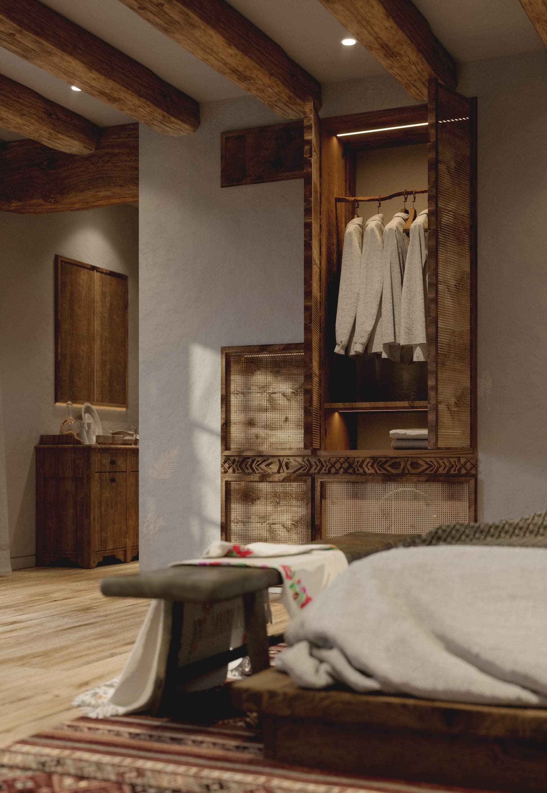 Matca guest room: open wardrobe, carved cabinet and bed bench