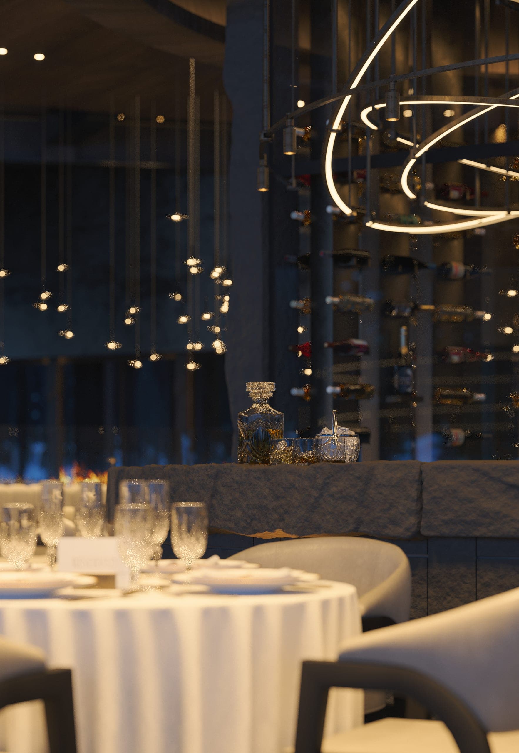Hotel Peștera restaurant: round table laid with white linen and crystal beneath ring-shaped lights