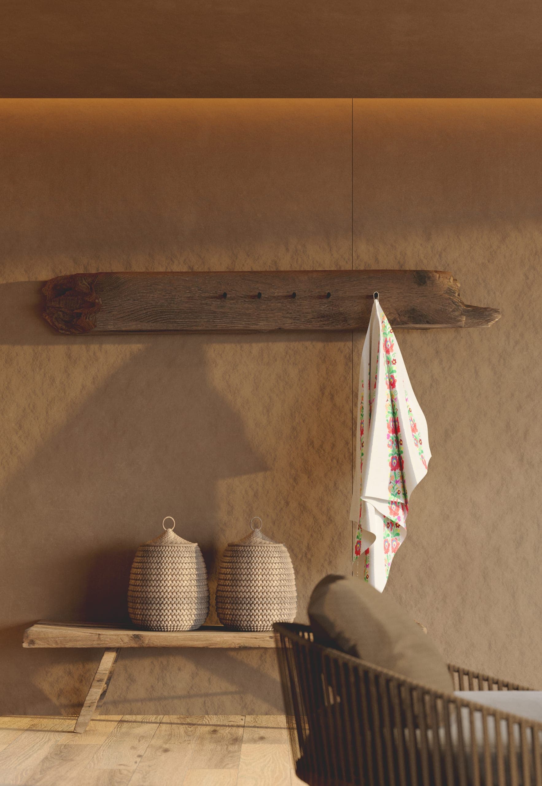 Natura Spa: plaster wall with a timber peg rail, woven baskets and an embroidered towel