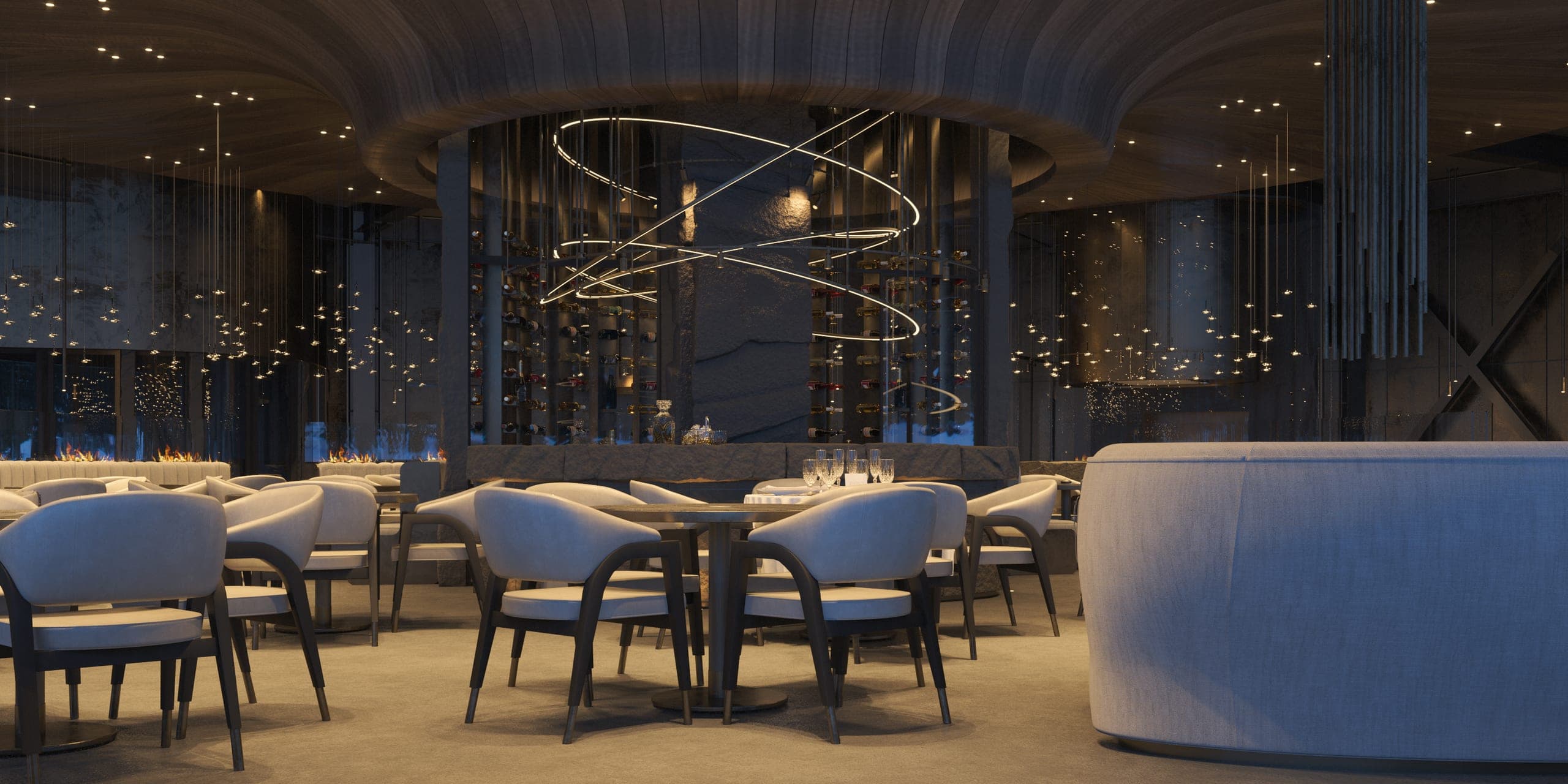 Hotel Peștera restaurant: dining room with a curved banquette and suspended light rings
