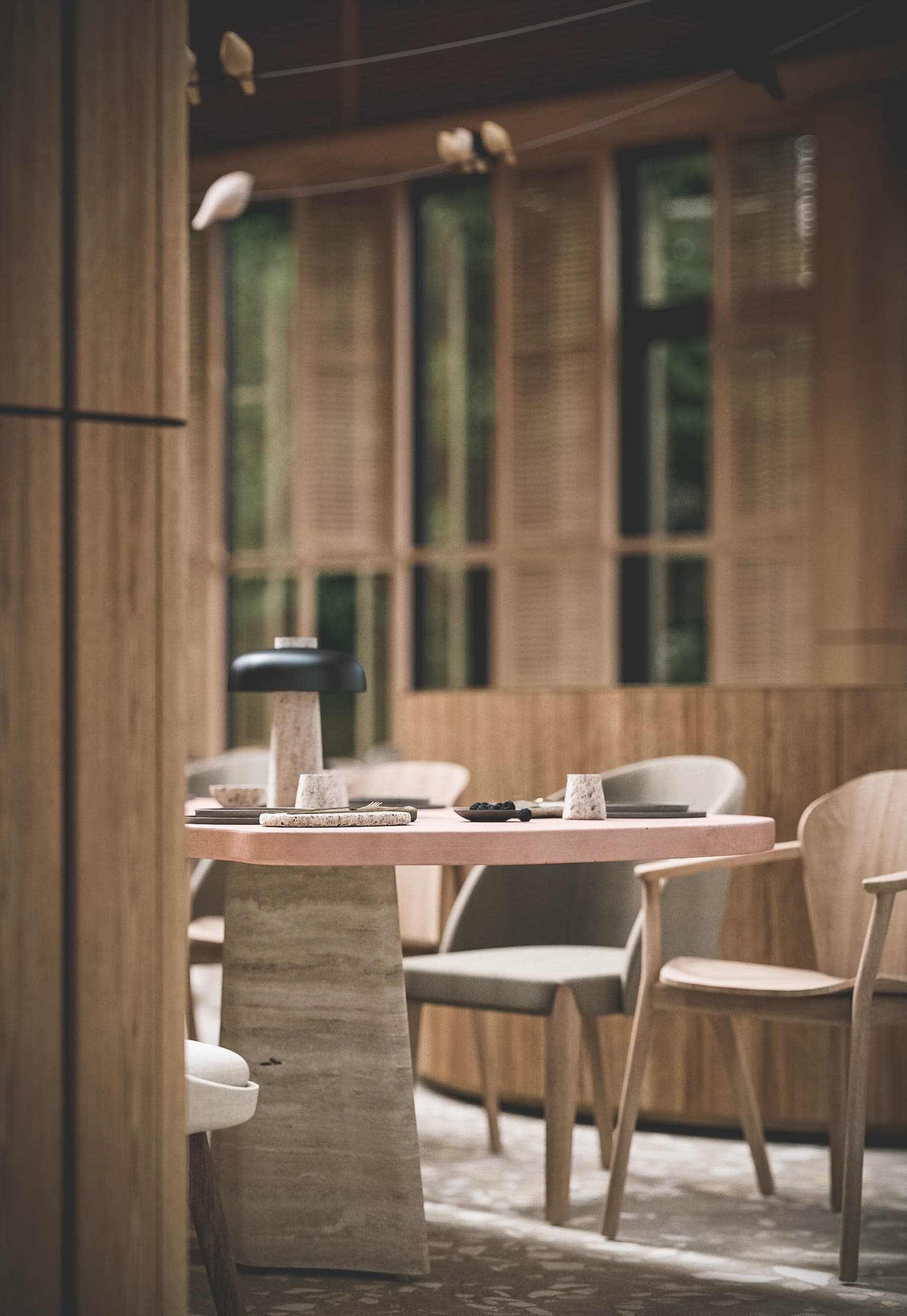 Bosco: table for two beside tall timber shutters