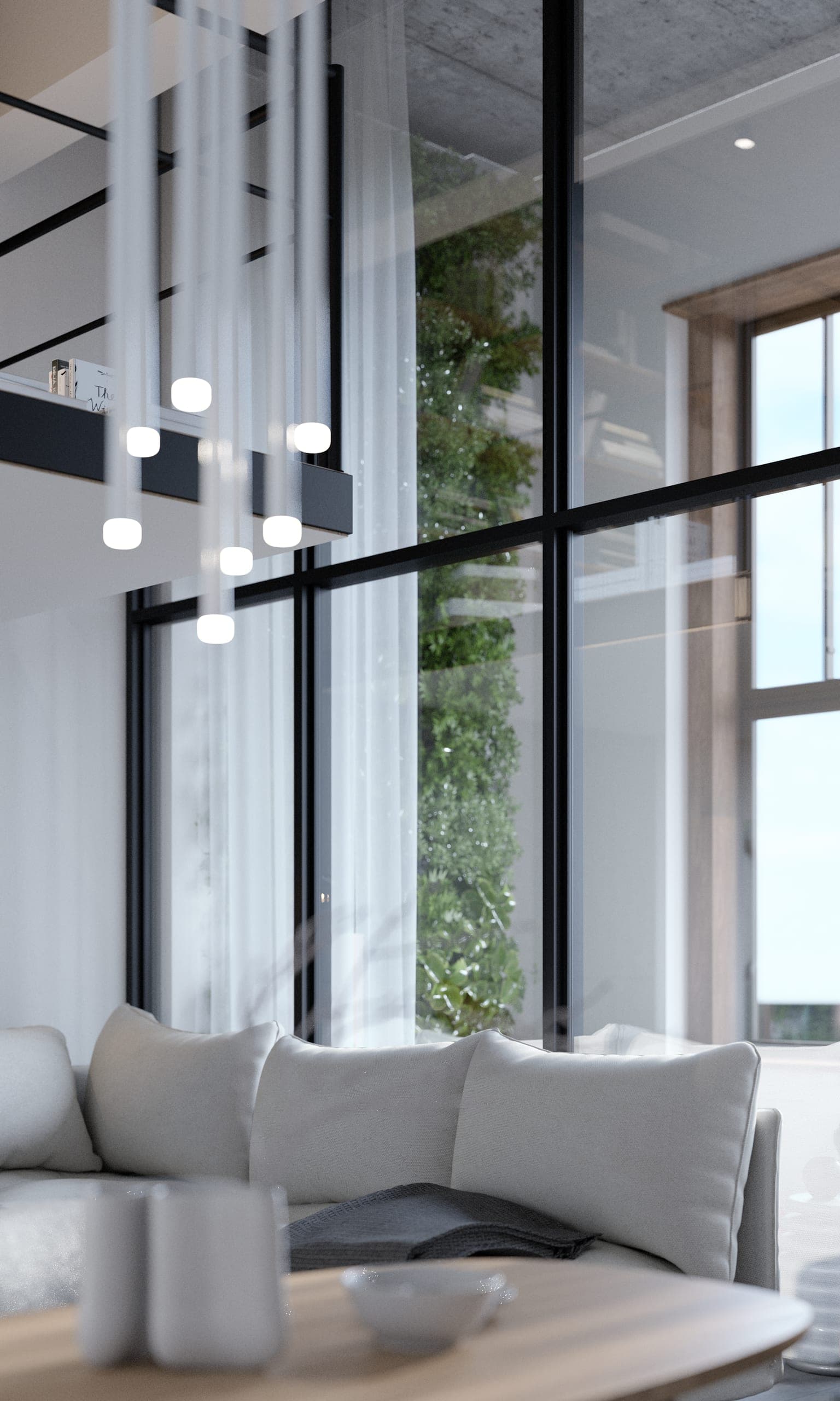 Plauen Apartment: pendant cluster above the sofa beside double-height glazing