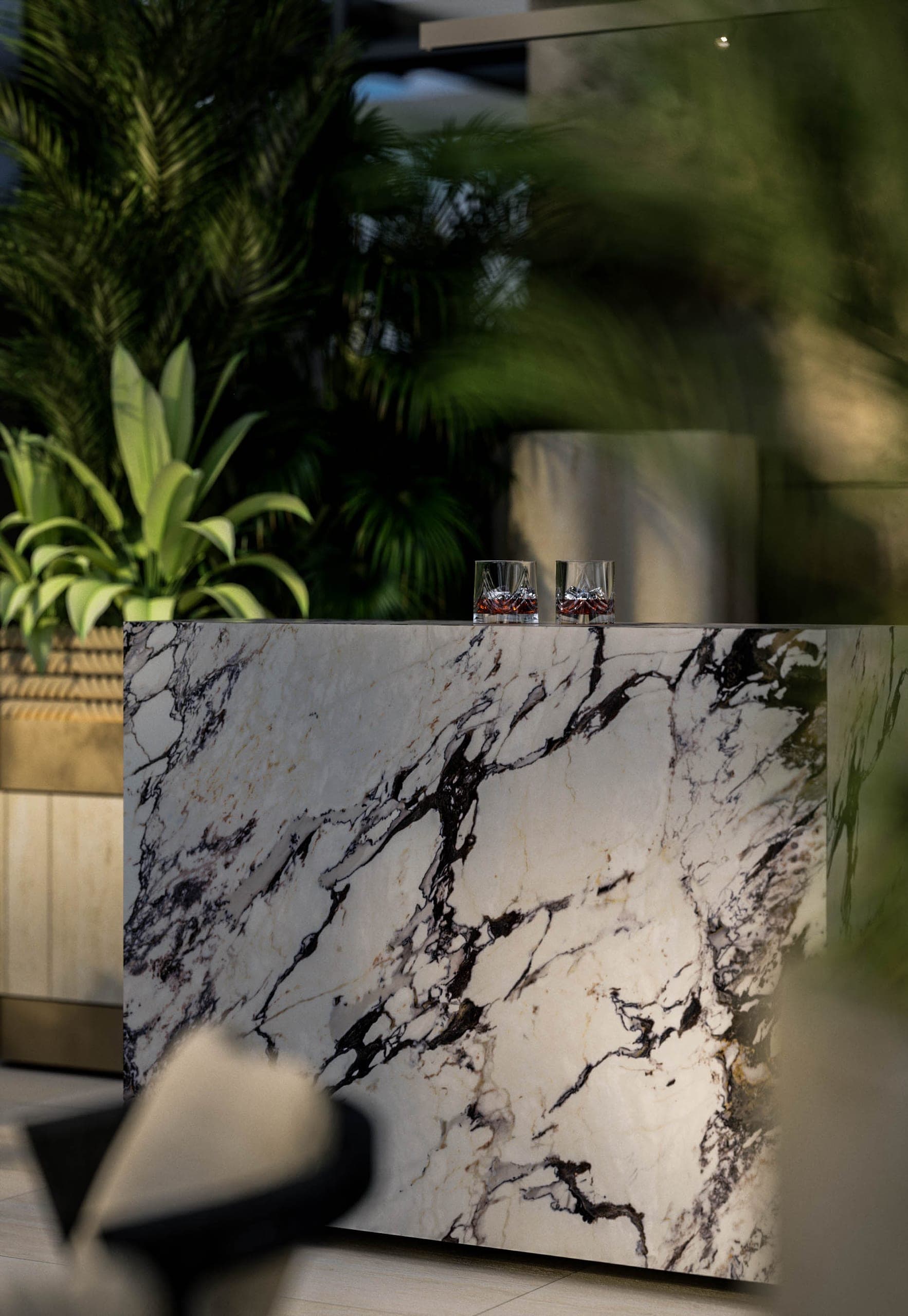 Opera Residence Restaurant: veined stone bar block framed by tropical planting