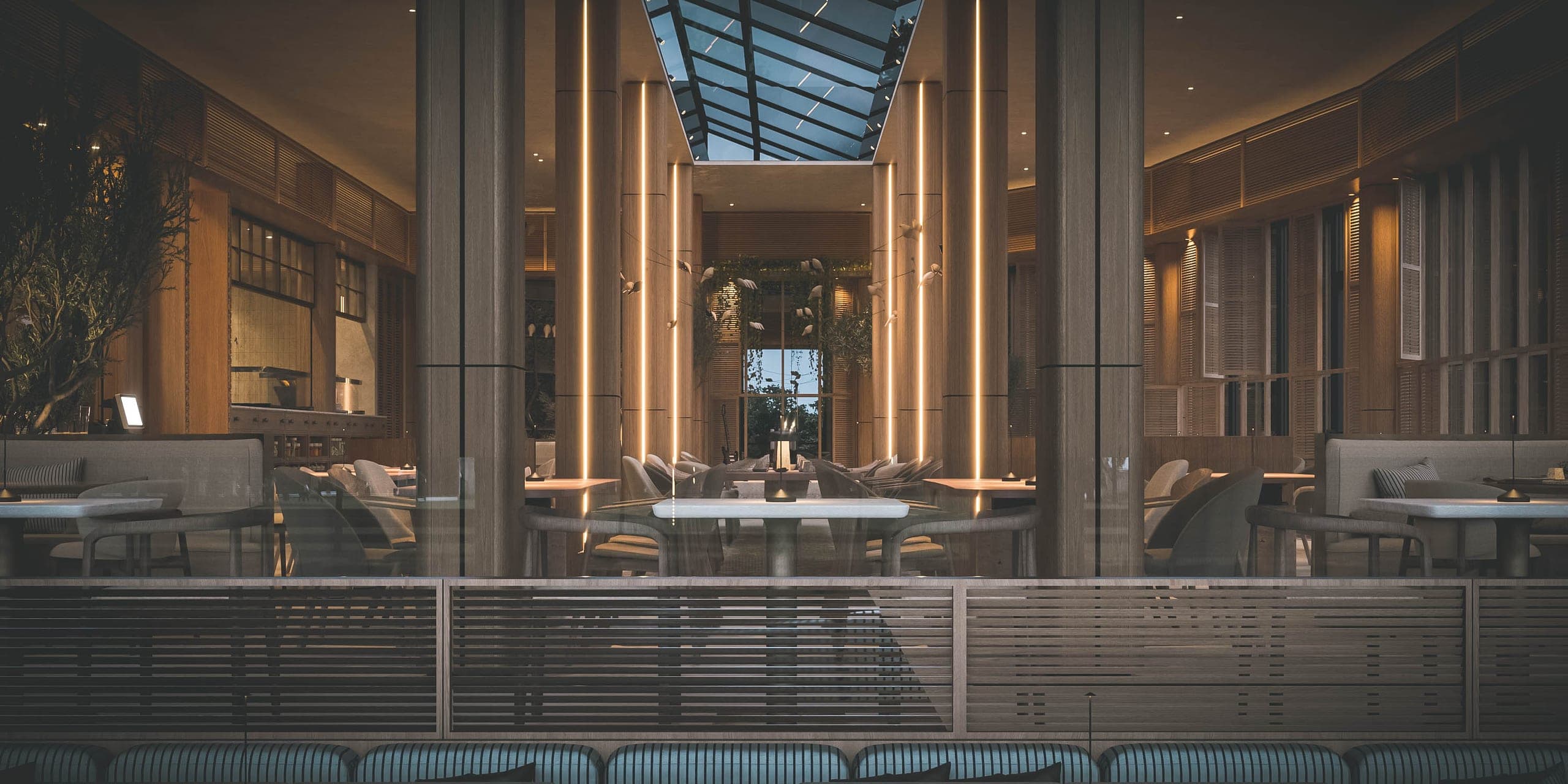 Bosco: dining hall in evening light beneath the glass roof