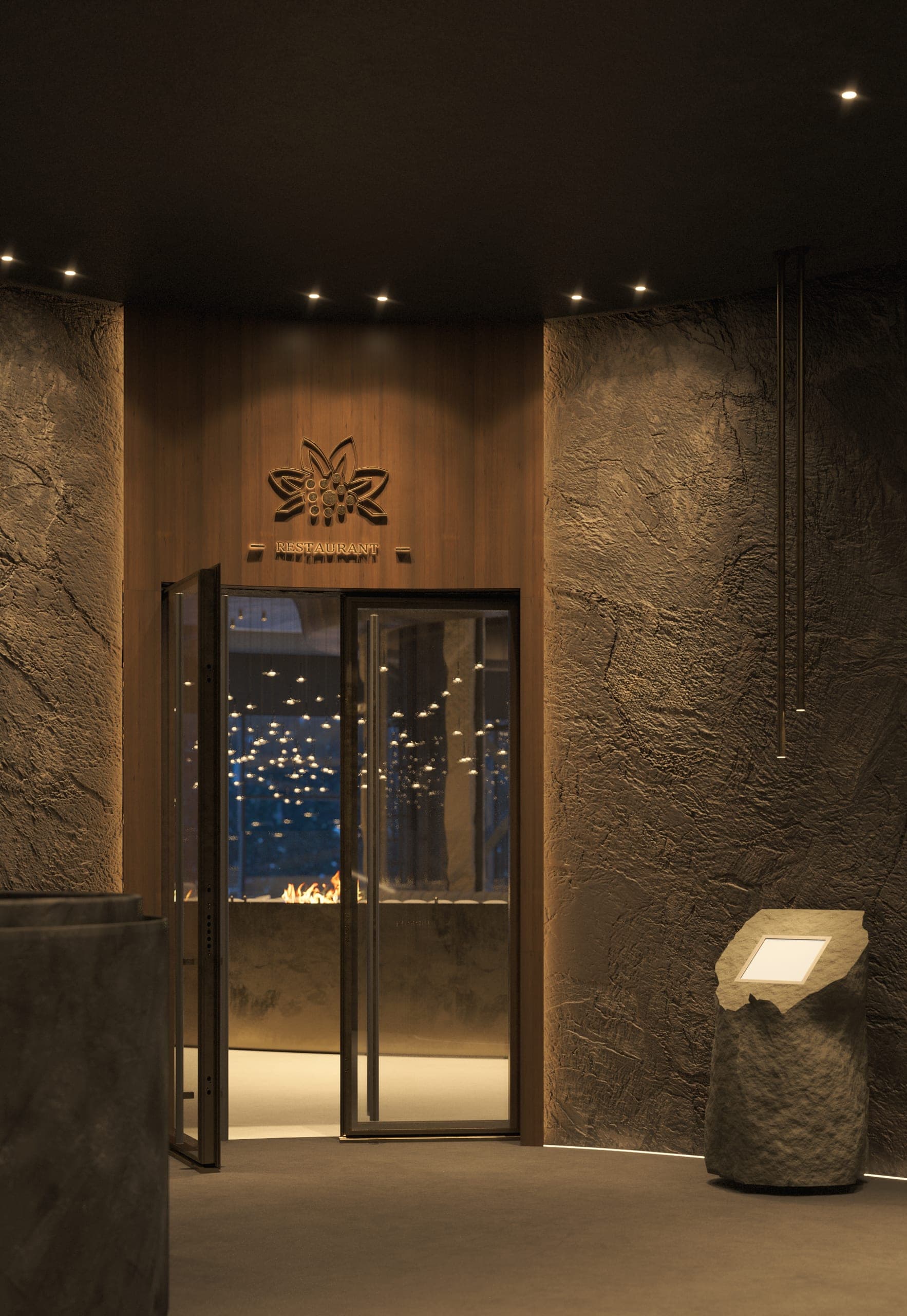 Hotel Peștera: guest corridor entrance with textured dark walls and a glazed door