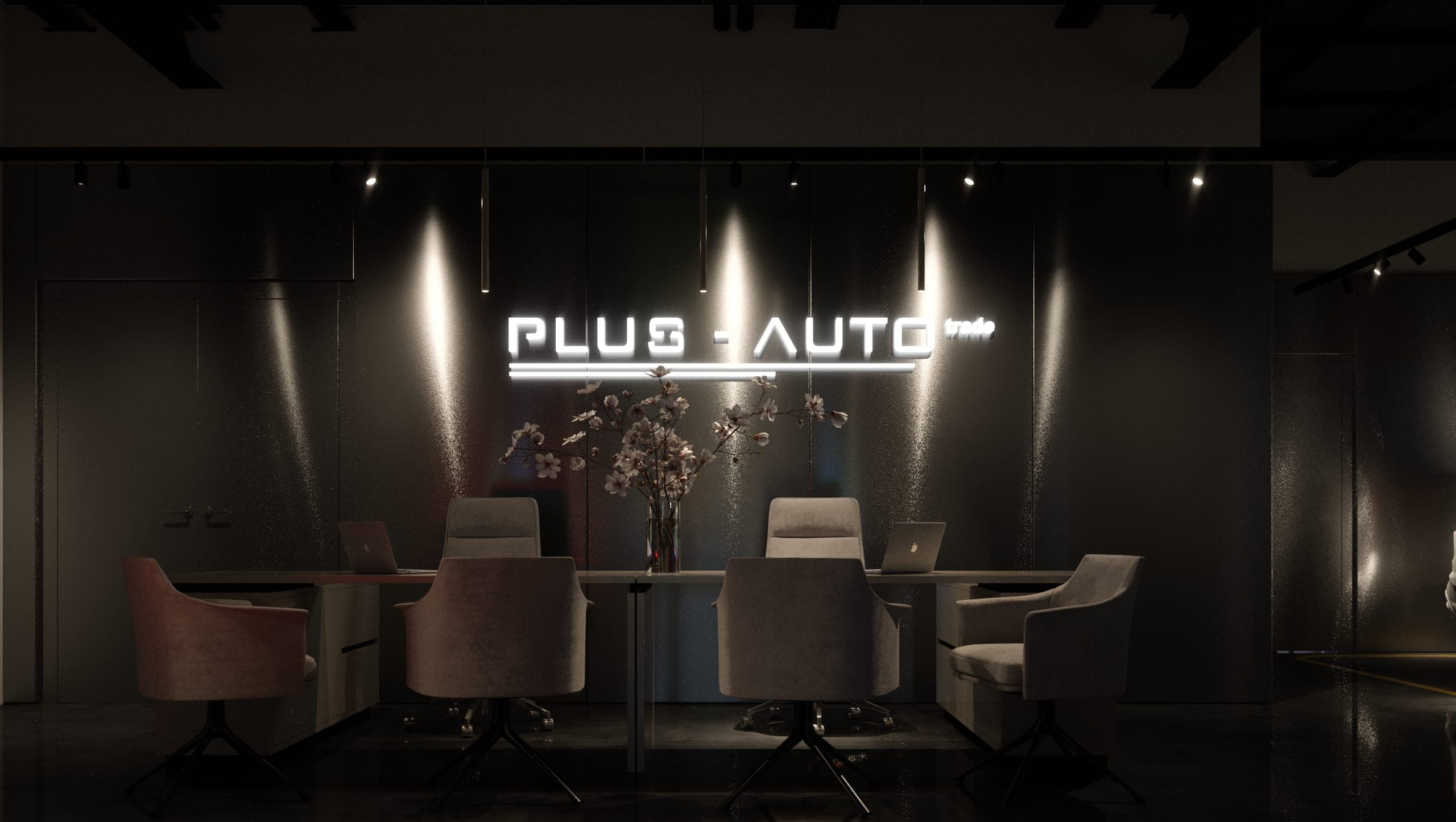 Plus Auto: consultation table beneath the illuminated Plus Auto sign