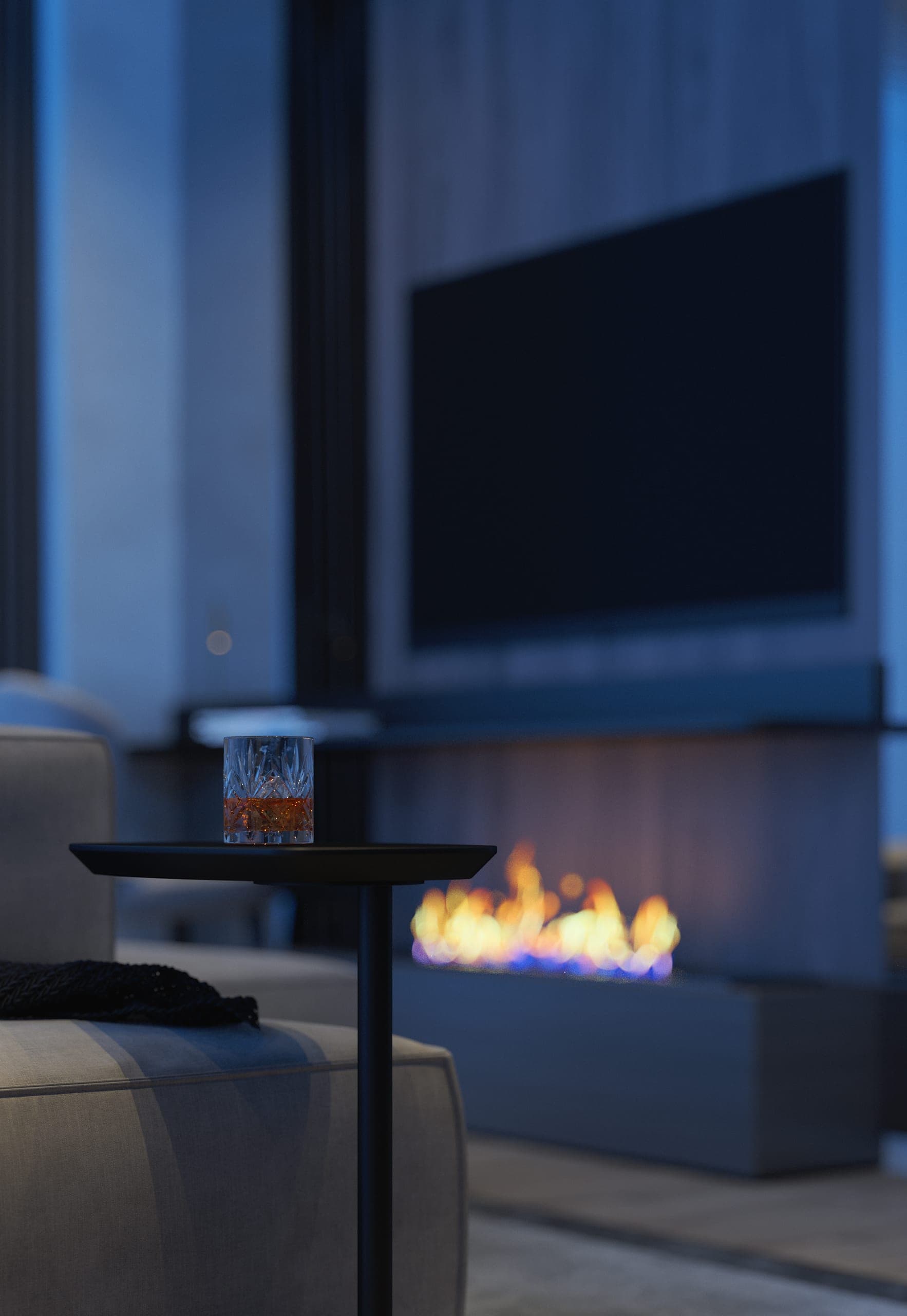 Hotel Peștera studio apartment: lounge chair and fireplace under a wall-mounted screen