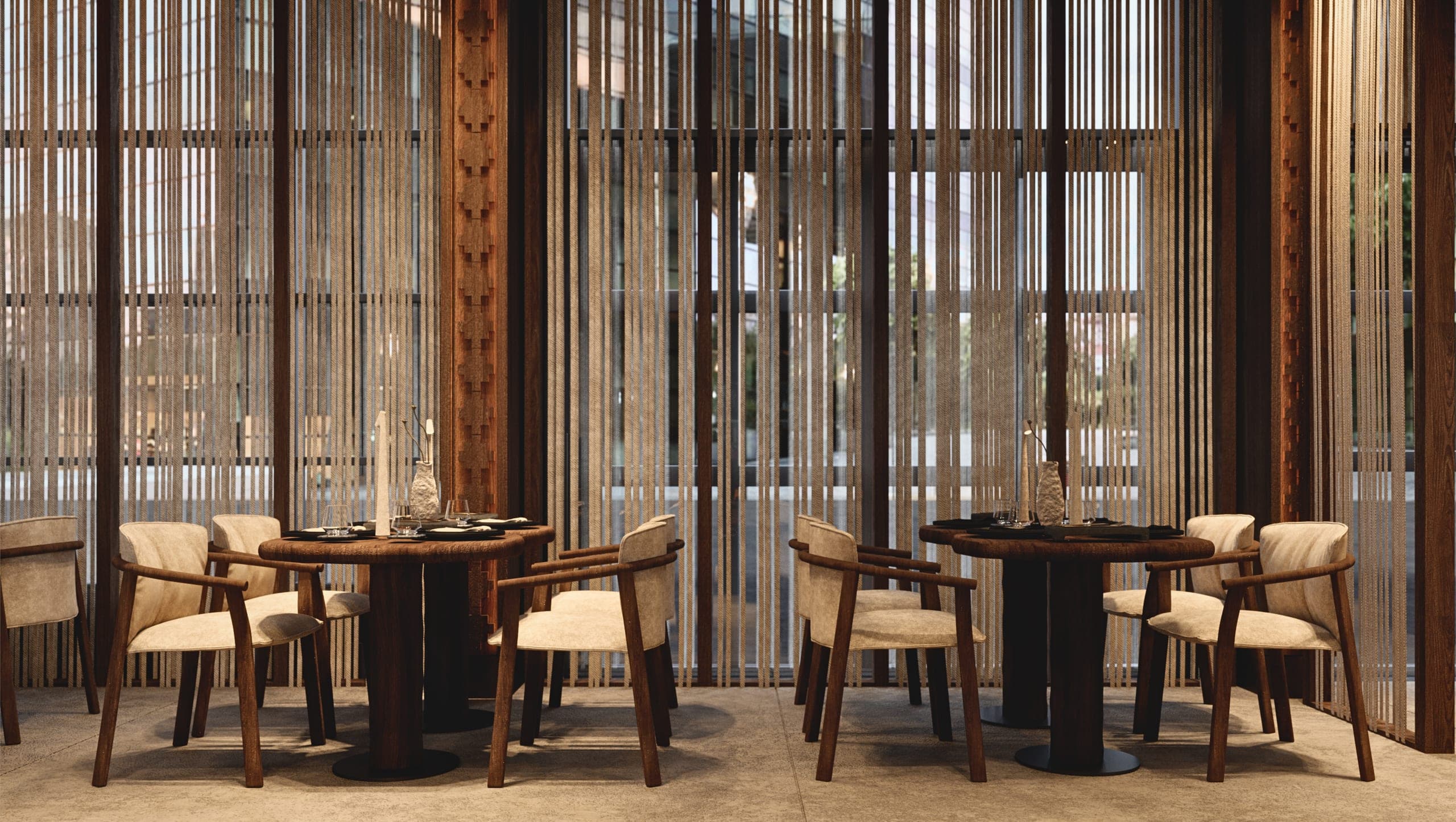 Bamboomat: round dining tables behind rope curtains