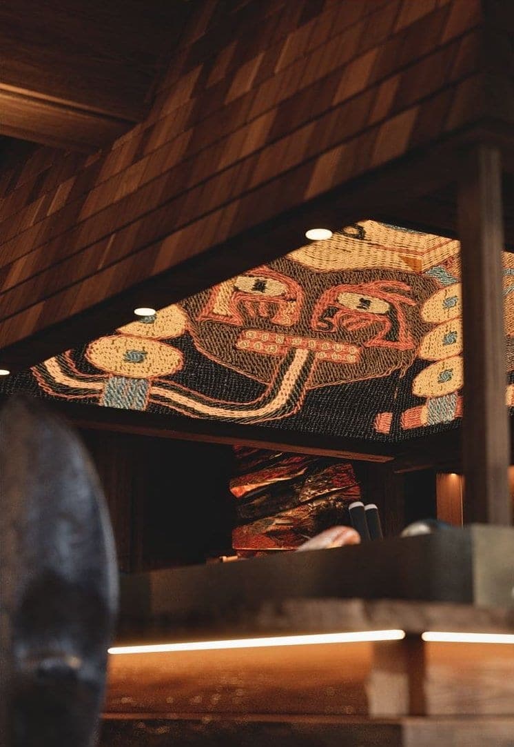 Bamboomat: patterned mosaic ceiling under the shingled canopy